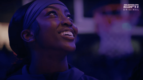 Flau'jae Johnson bears a huge smile as she looks upwards.